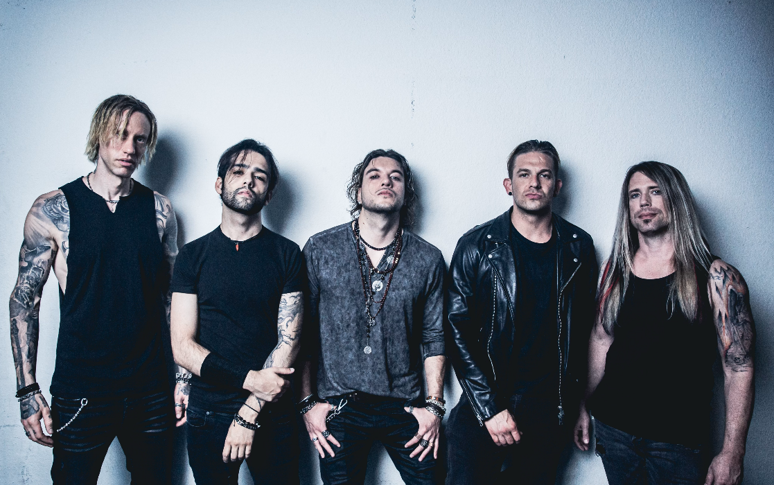 A group of men posing for a picture Description automatically generated