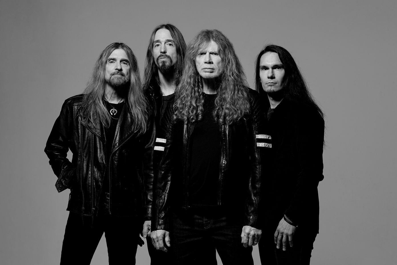 A group of men with long hair

AI-generated content may be incorrect.