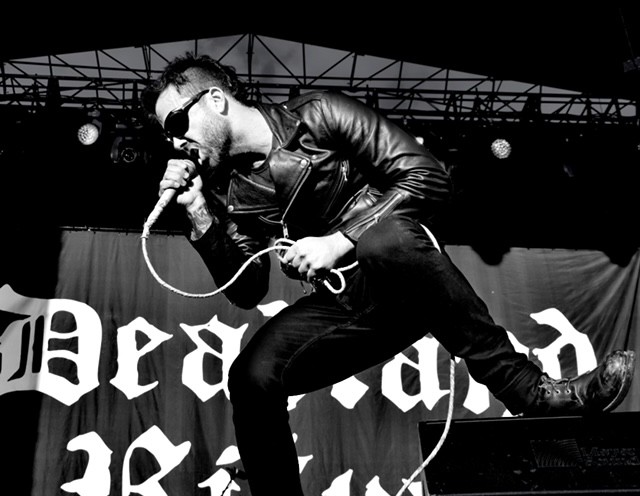 A person holding a microphone

AI-generated content may be incorrect.