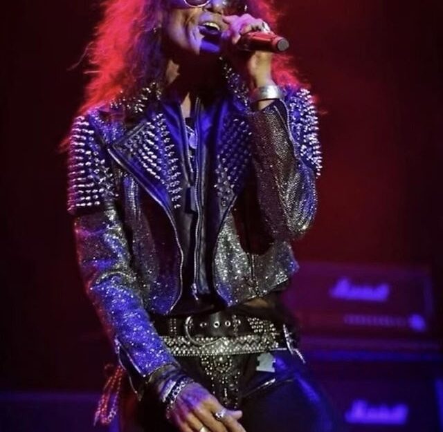 A person singing into a microphone AI-generated content may be incorrect.